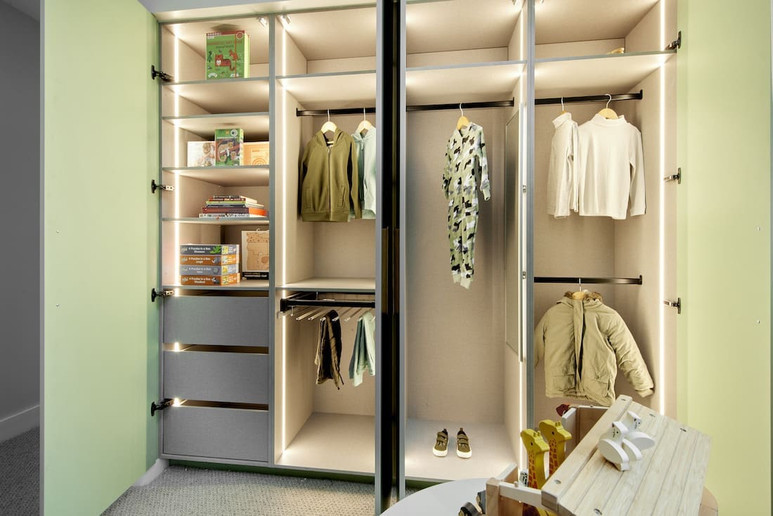 Inside kids wardrobe with green doors