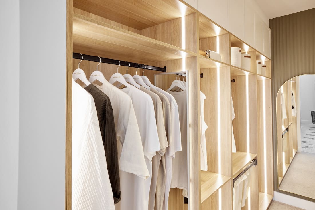 Walk in wardrobe with lighting in shelves