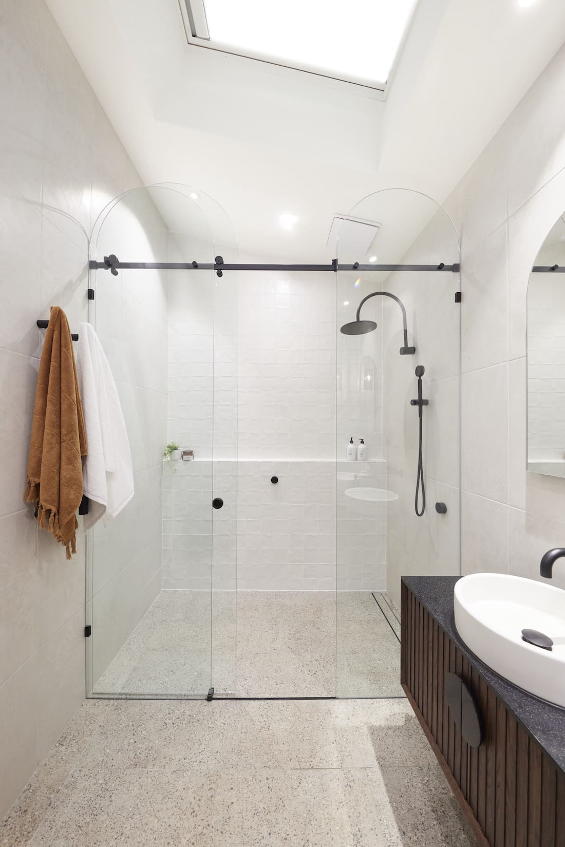 White and terrazzo bathroom with black hardware