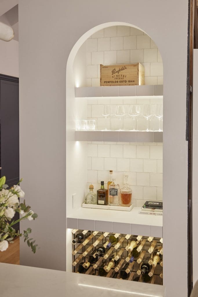 Arched recessed space in kitchen for bar