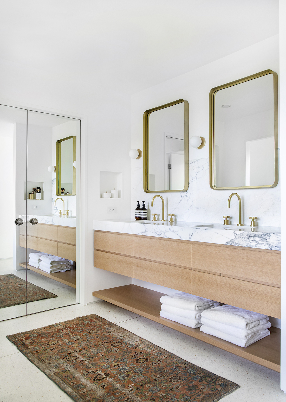 Mandy Moore's bathroom with gold framed mirrors