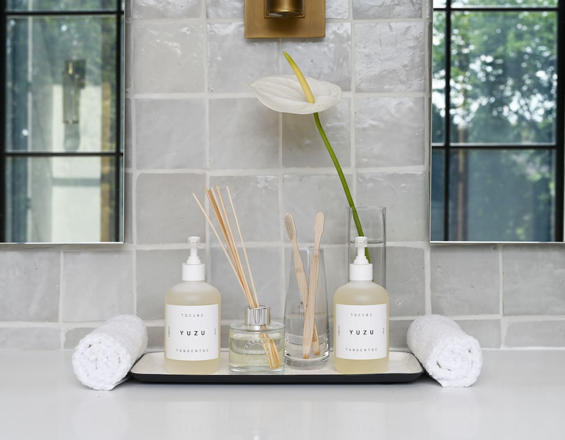 Grey tiles behind bathroom vignette