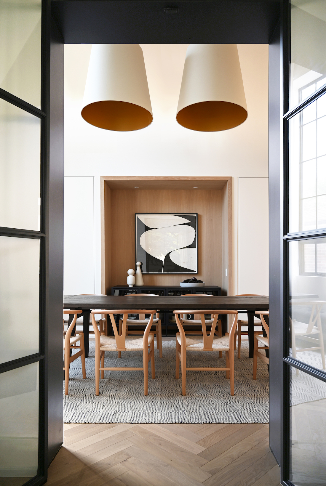 Dining table with oversized pendant lights