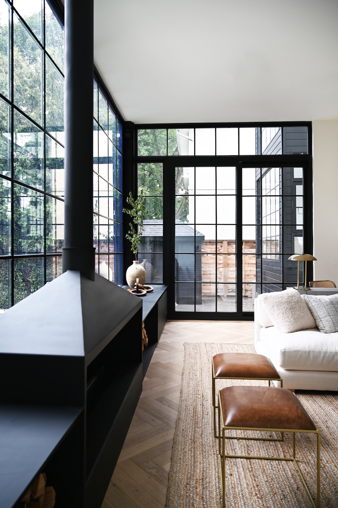 Black framed windows and doors in living room