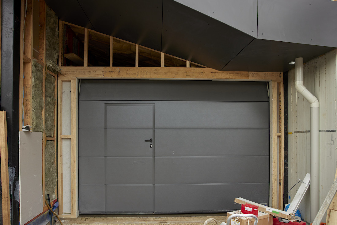 Door within a door garage