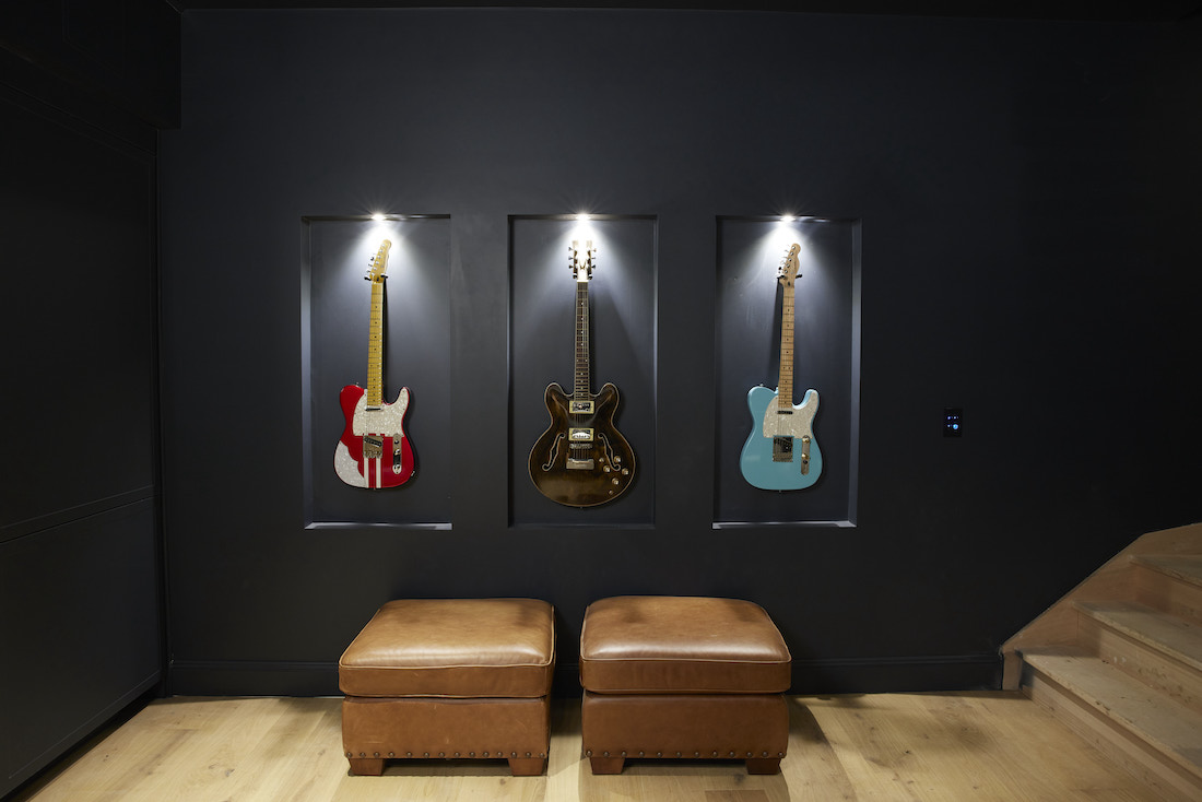 Wall niches with guitars with down lights