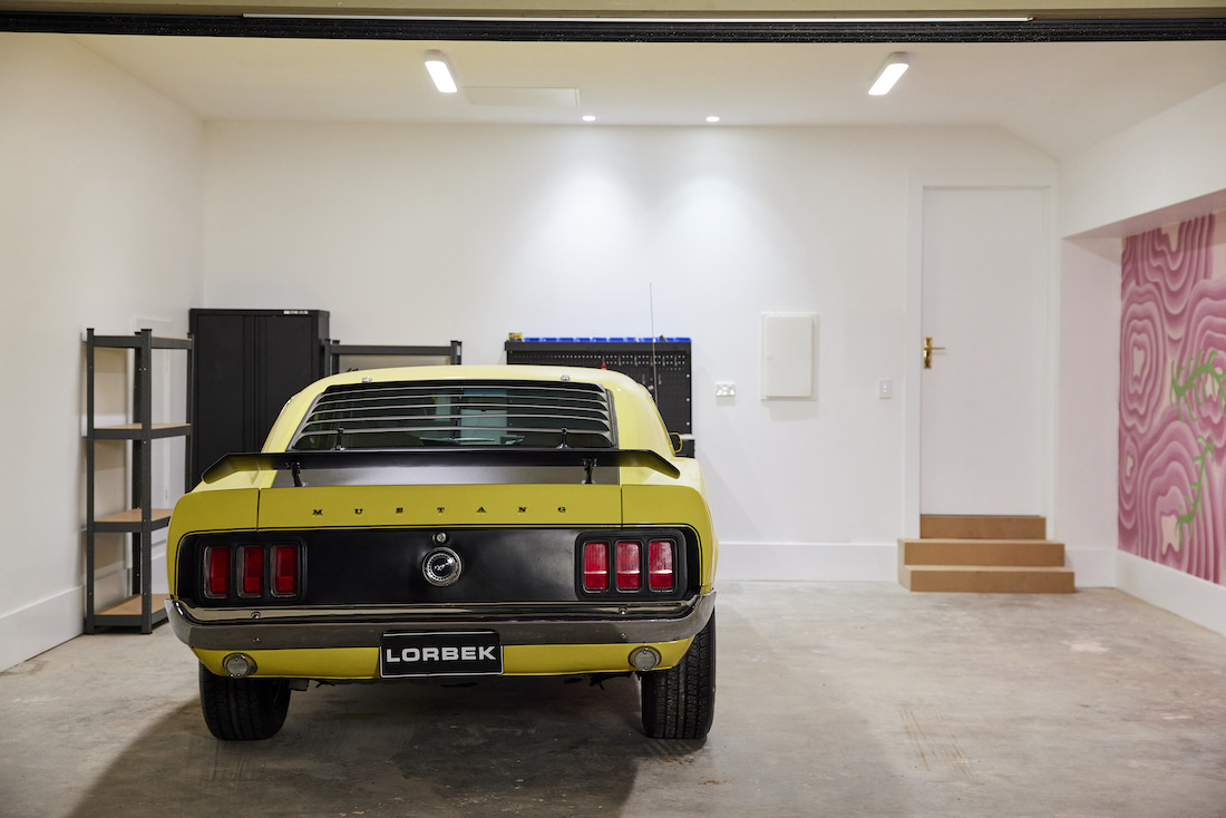 Garage with vintage yellow mustang