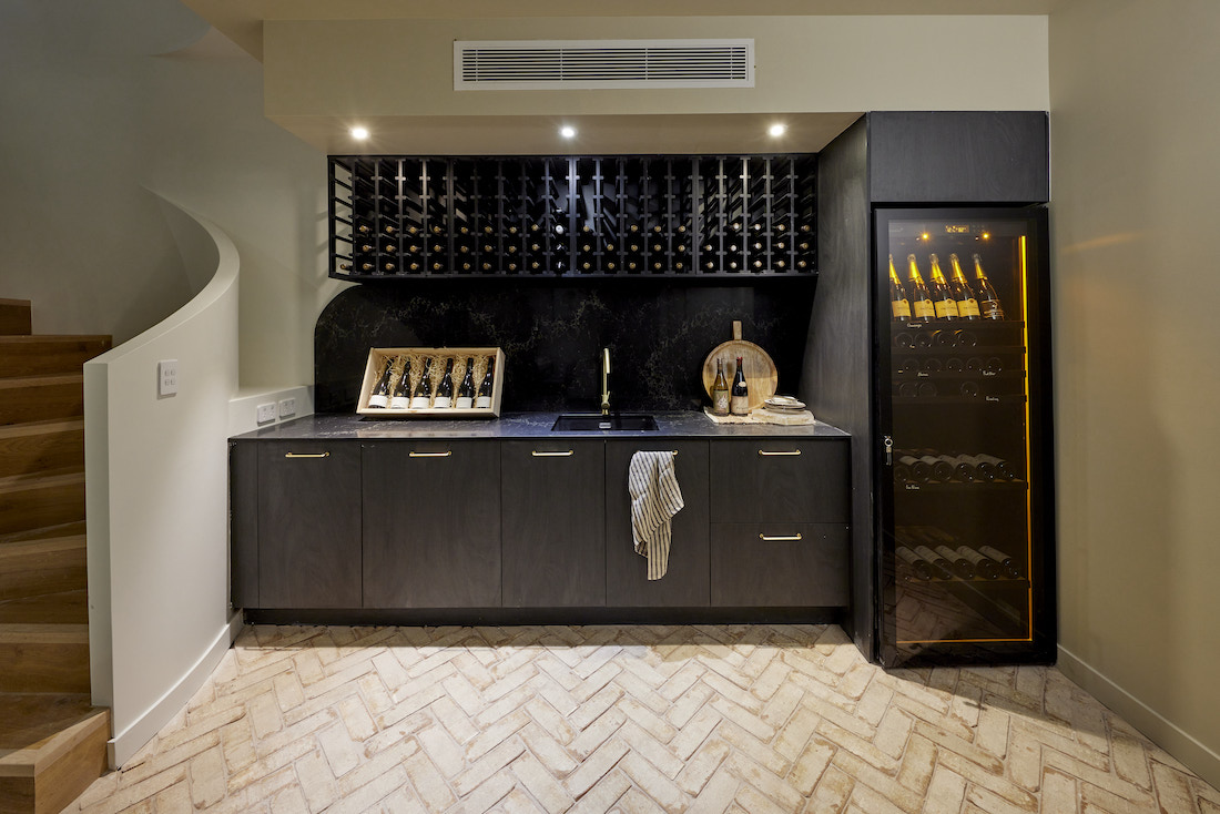Wine storage and fridge in basement
