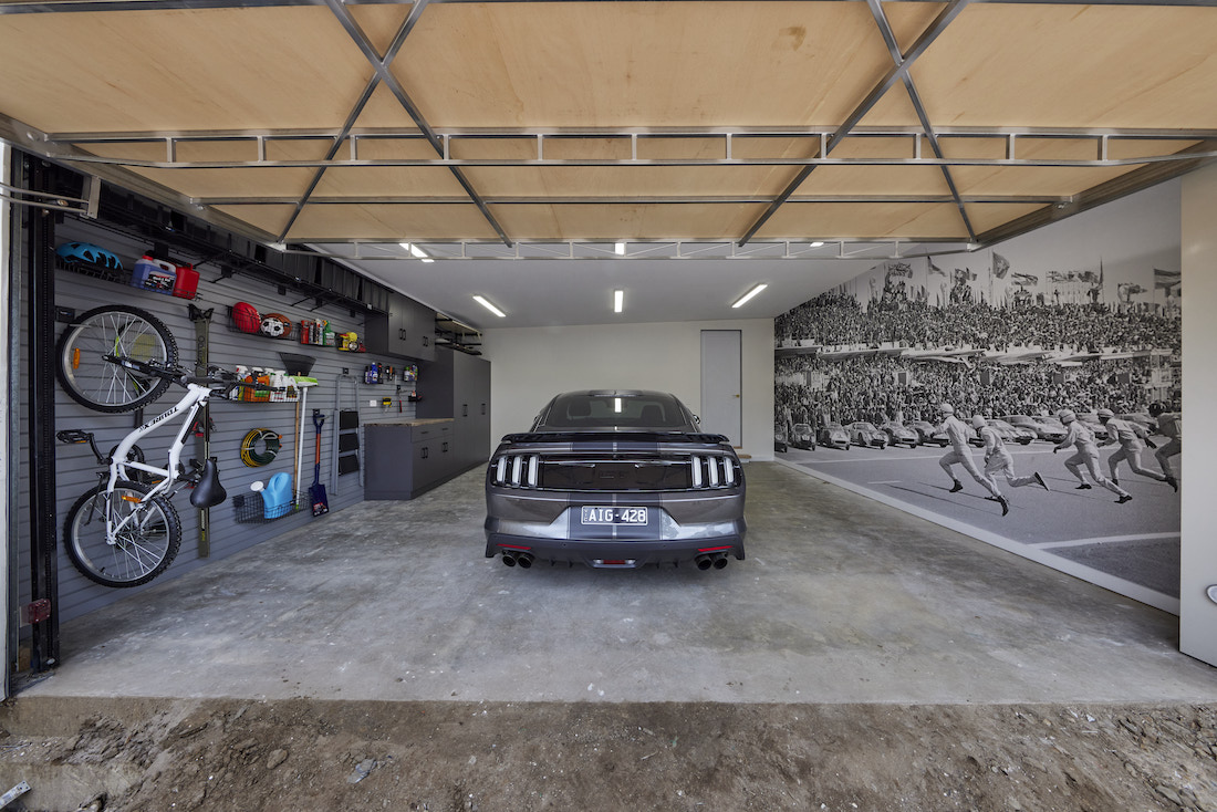 Garage with wall storage and wall paper
