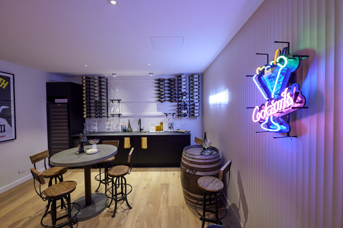 Basement bar are with wine barrel seating