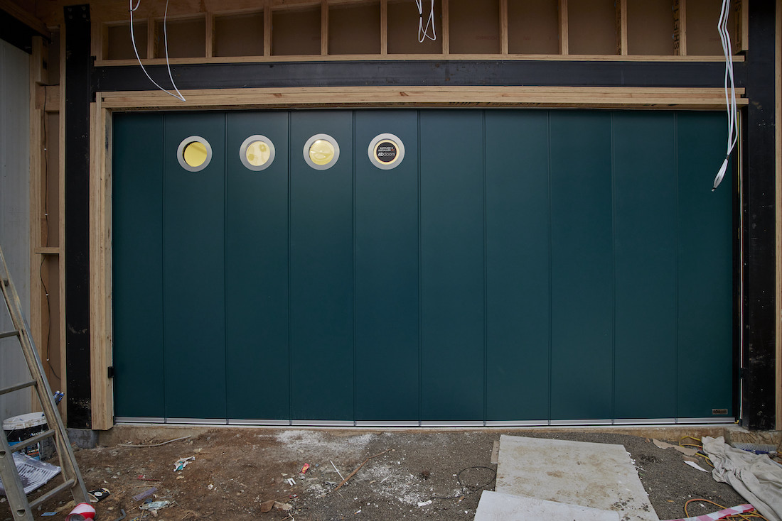 Horizontal opening teal green garage door