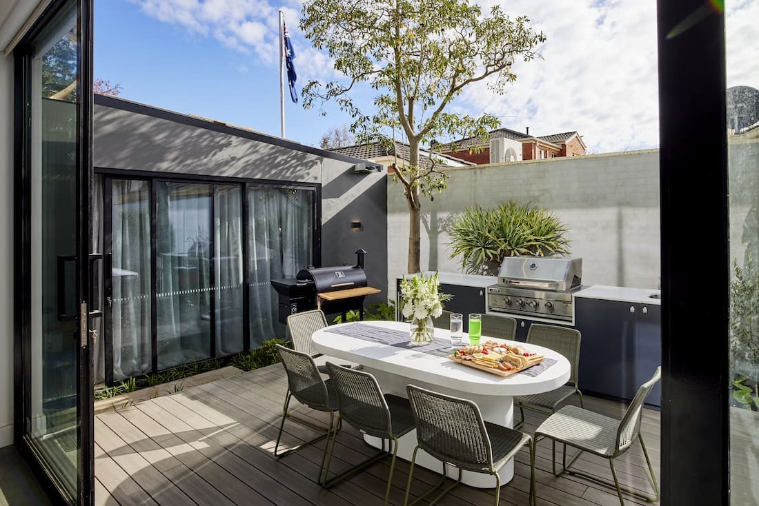 Outdoor dining space and kitchen