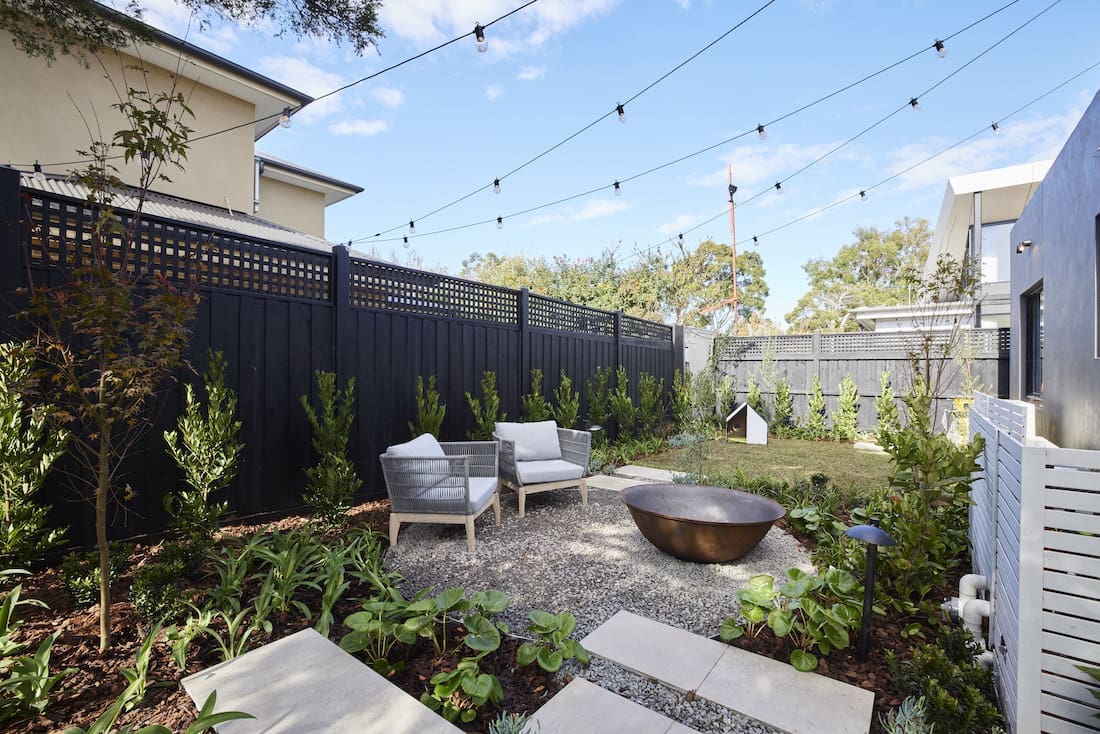 Fire pit with seating and festoon lighting