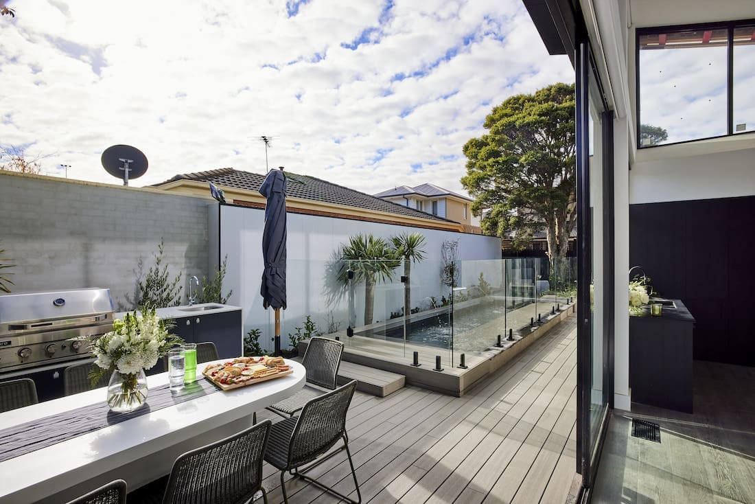 Outdoor deck dining space and pool