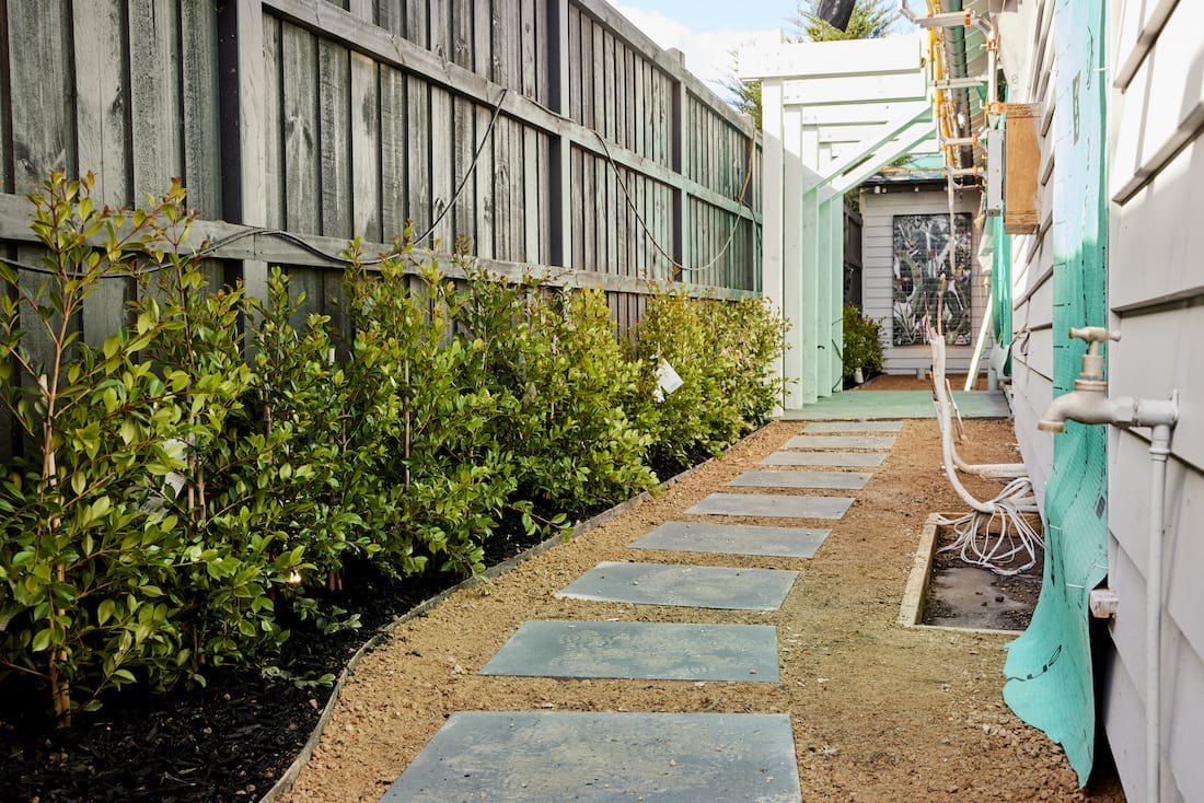 Paving down side of house