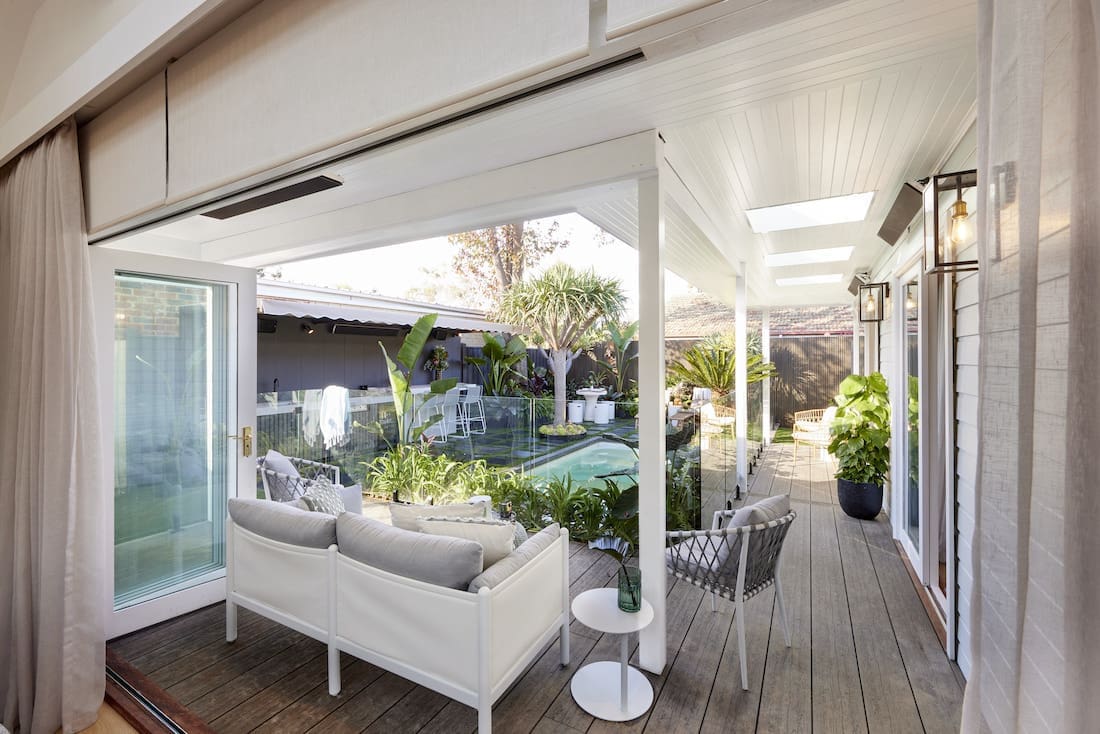 View to outdoor lounge from inside of home