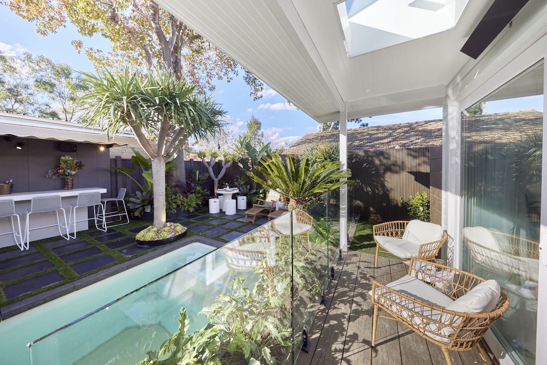 Side deck with skylights and view of pool