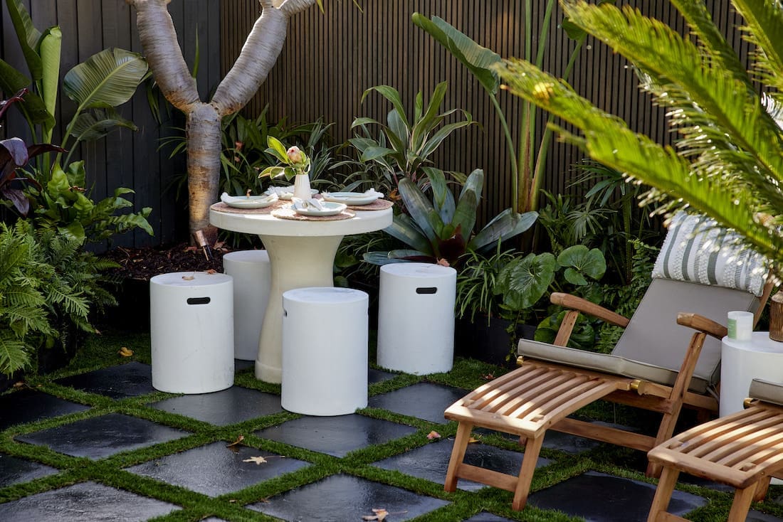 Side table and seating in garden nook