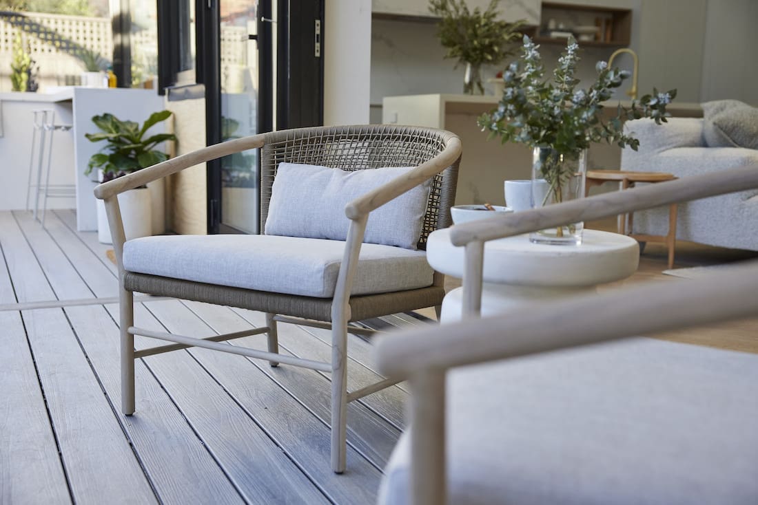 Outdoor lounge chairs off inside living room