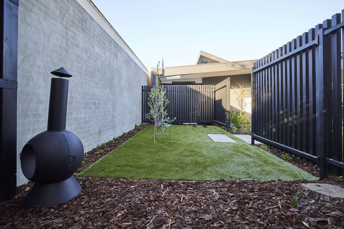 Artificial grass area in back yard