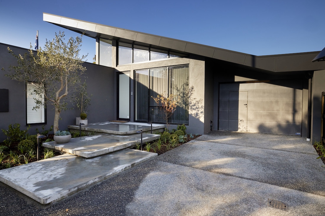 Modern facade of home with concrete steps