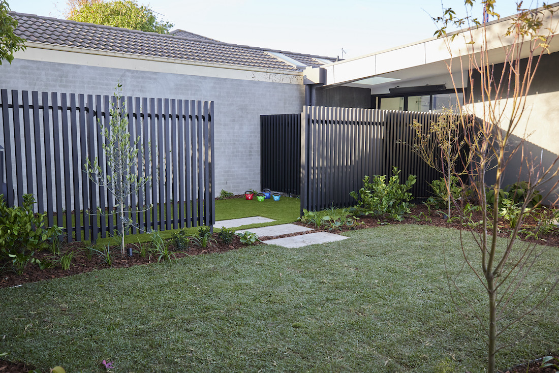 Fenced off space with artificial grass