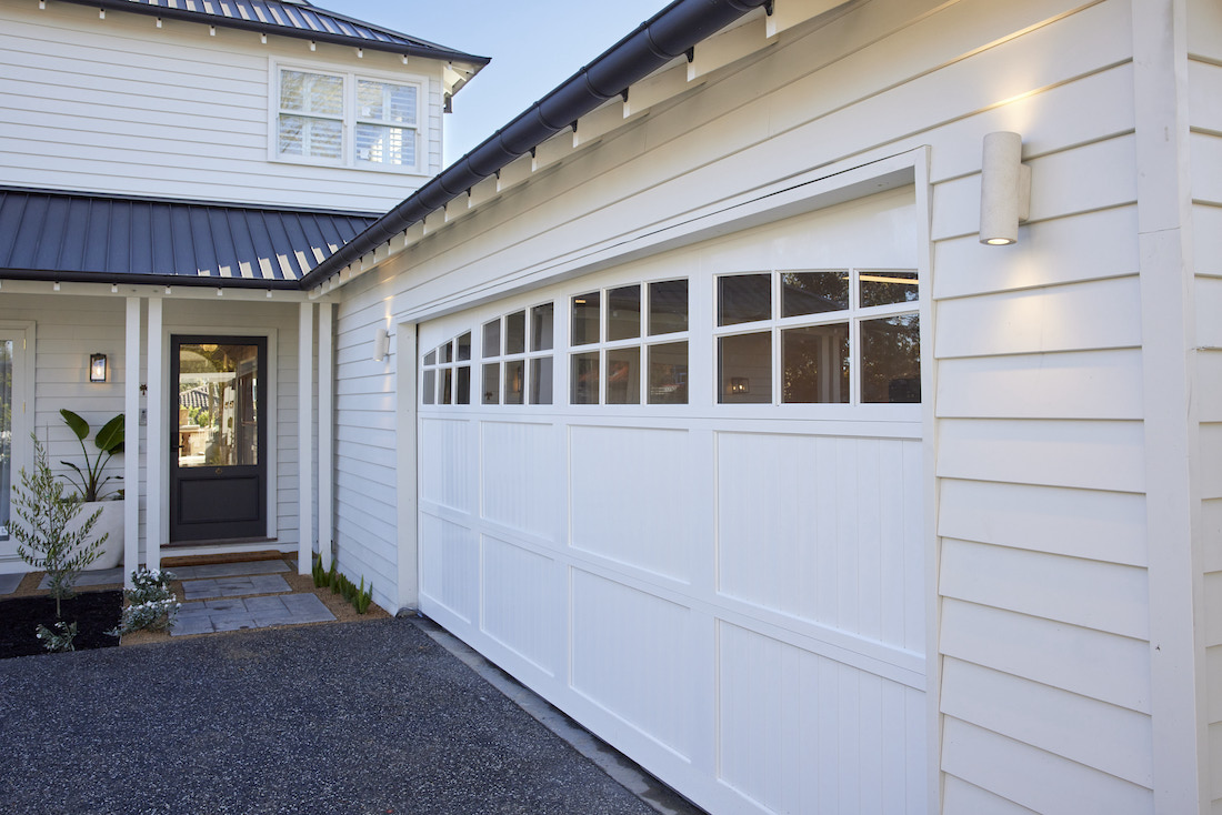 Hamptons style garage door and entrance to homed