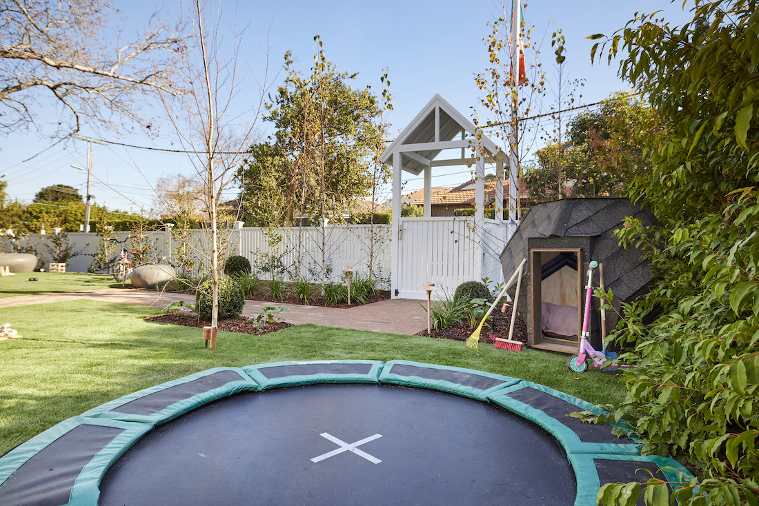 Built in trampoline and cubby house in front garden