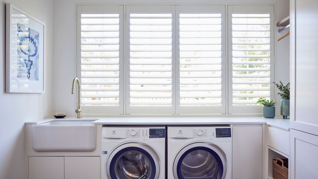 Laundry with farmhouse sink and shutters