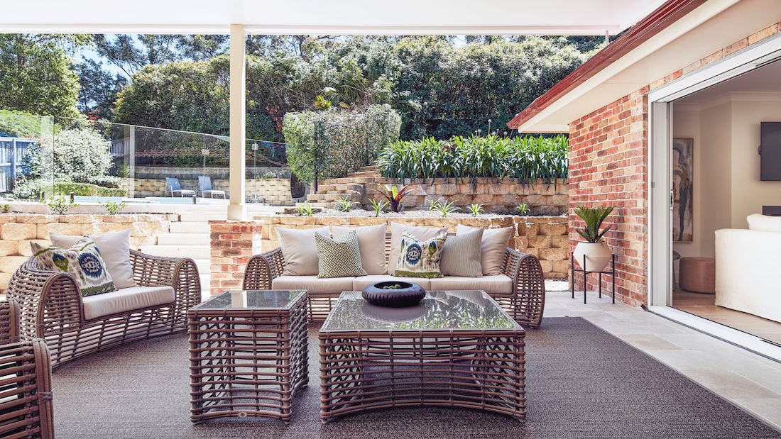 Outdoor entertaining space with cane furniture