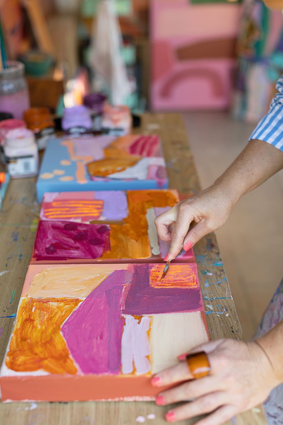 Jackie Anderson painting in studio