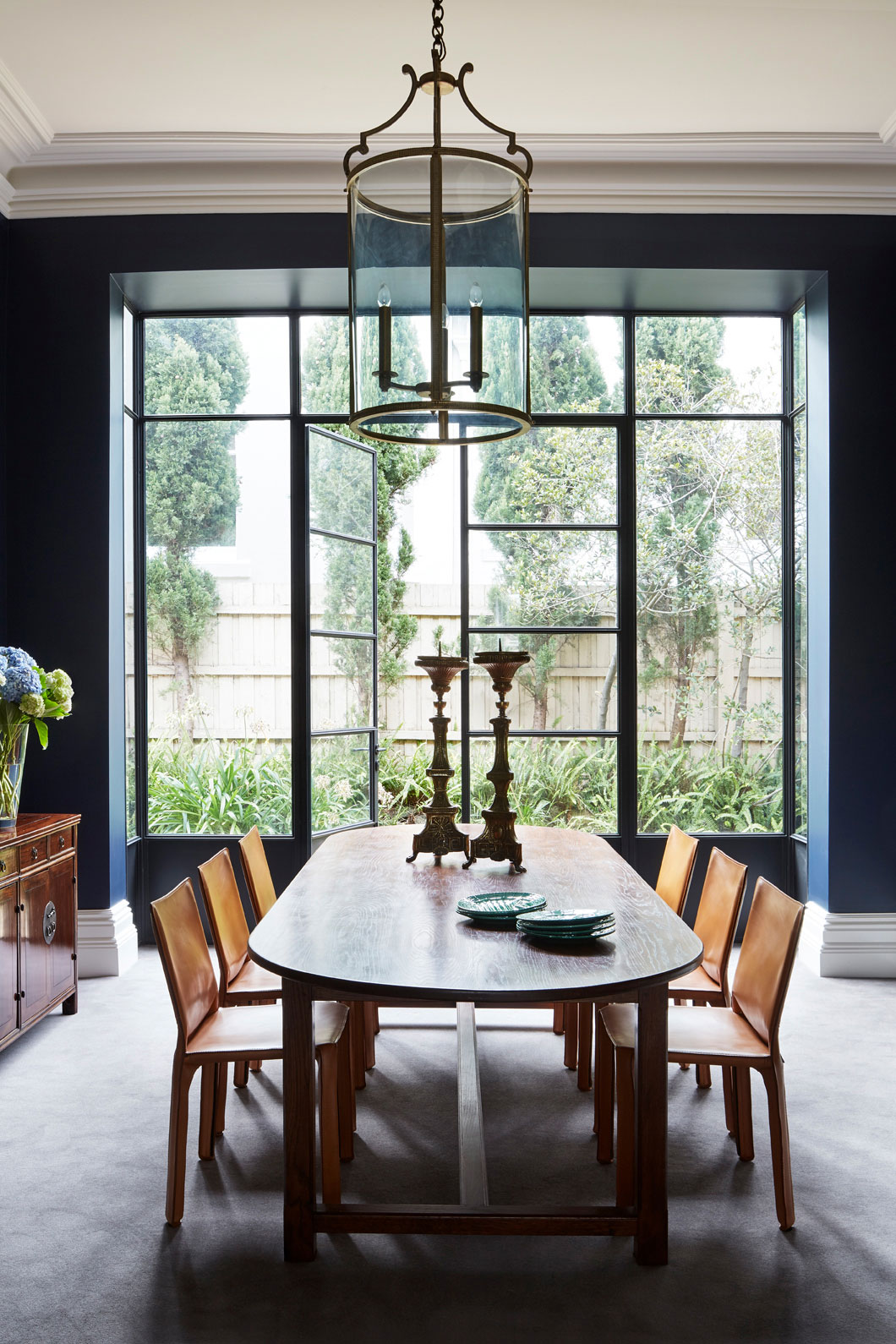 Dining room with dark walls and huge window