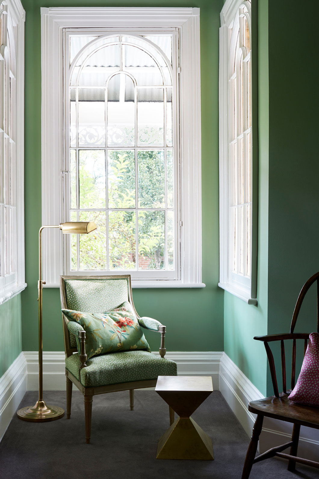 Green walls in sitting room of heritage home
