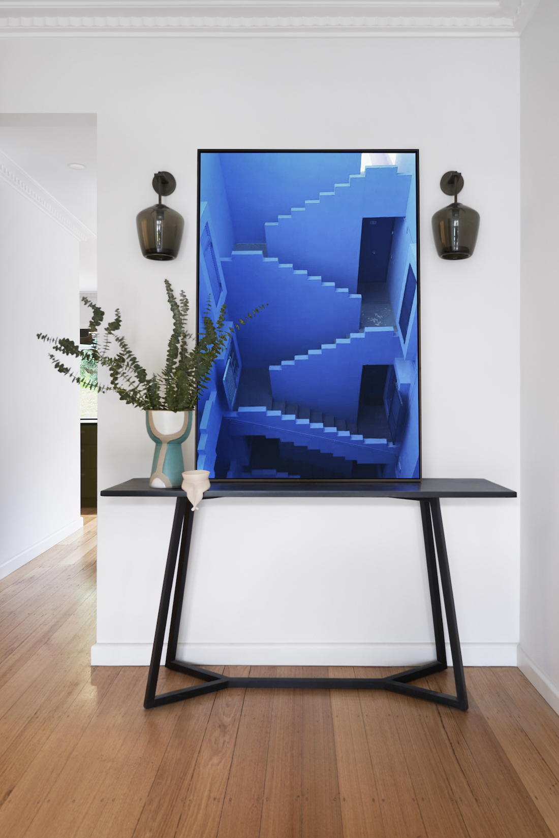 Bright blue artwork on console table