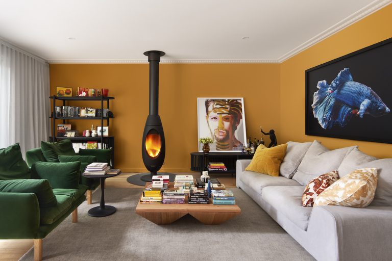 Mustard yellow living room with unique fireplace