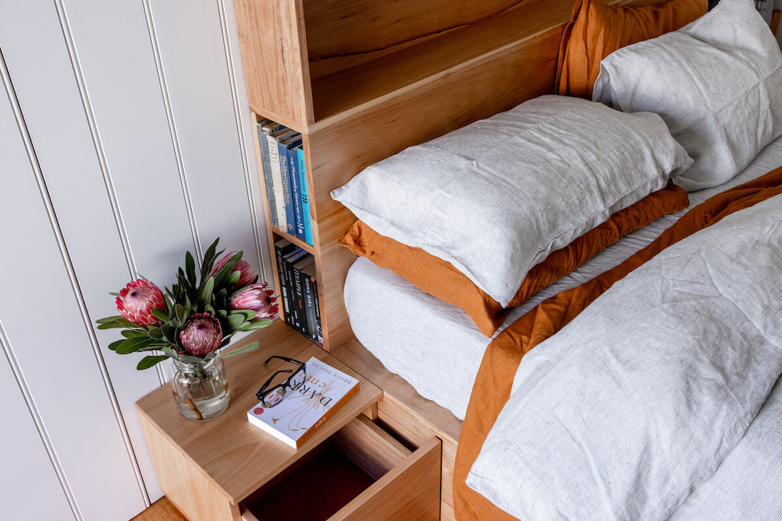 Bed with bookshelf by Al + Imo
