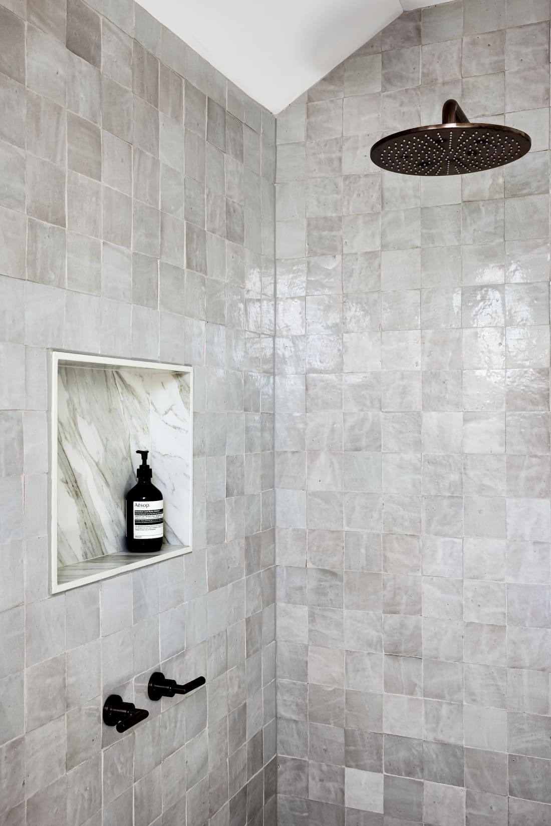 Grey shower with black tapware