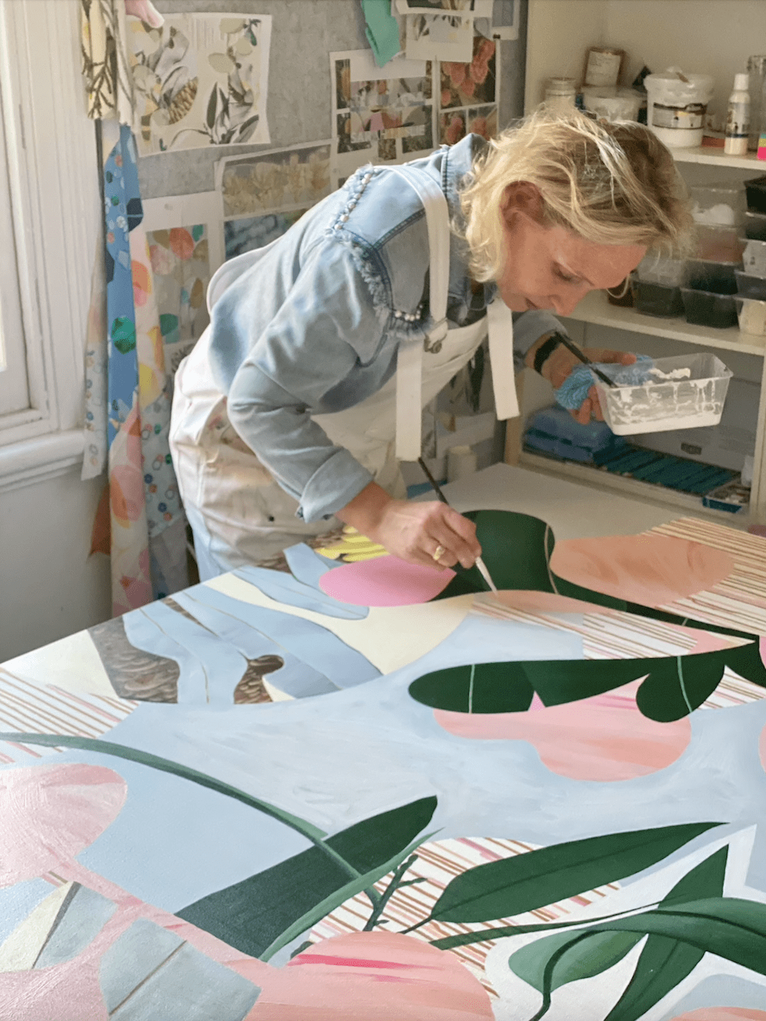 Artist Sarah Leslie working on art in studio