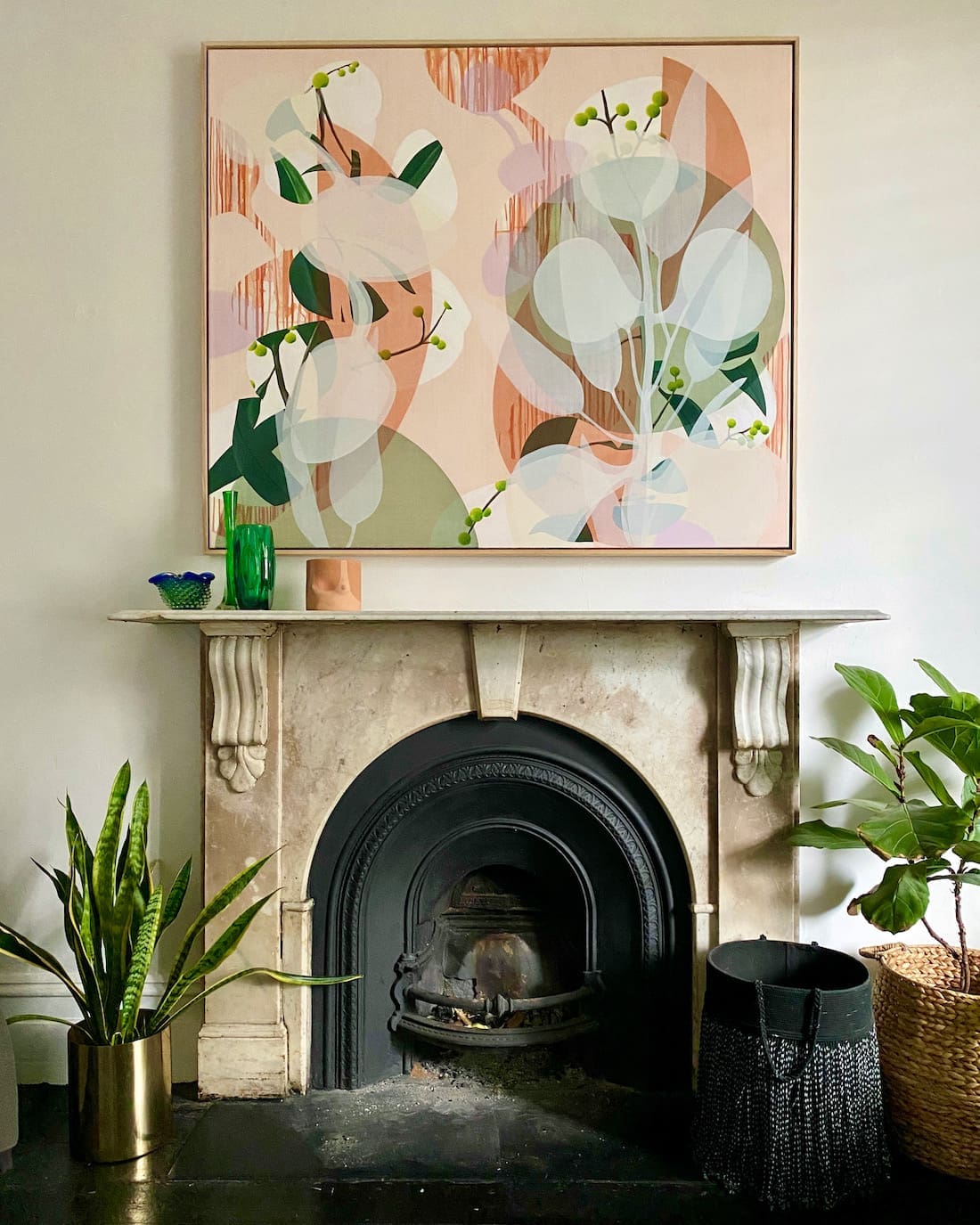 Fireplace with Sarah Leslie artwork above mantle