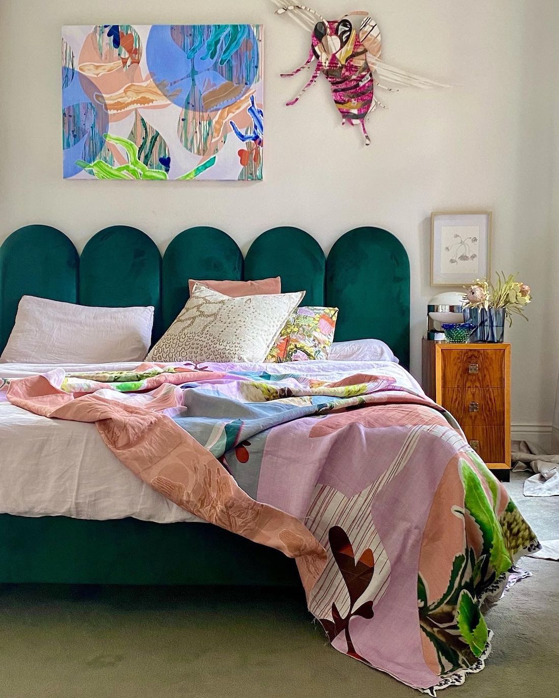 Teal bed with colourful throw by Sarah Leslie