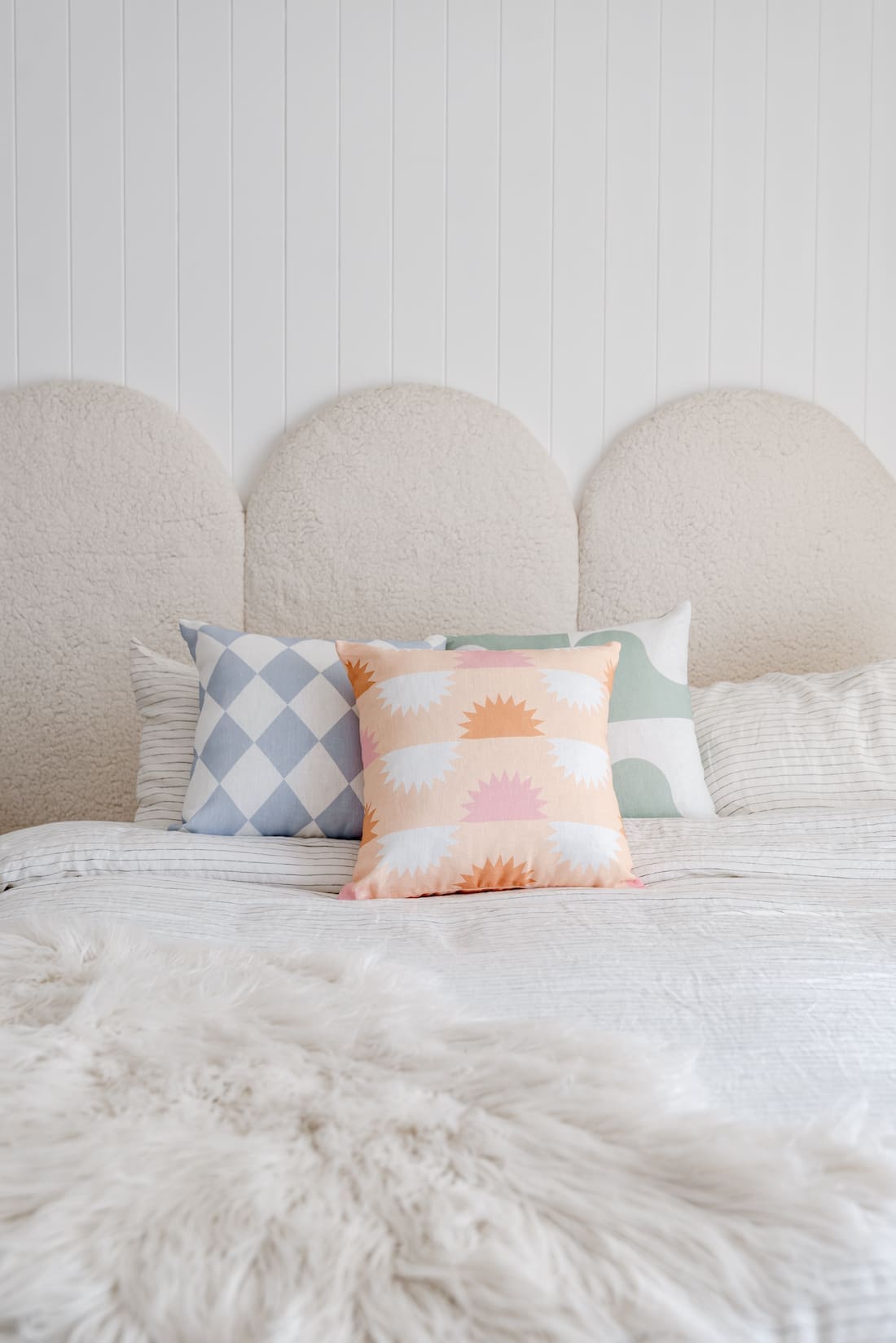 Arched Boucle bedhead with The Tartan Space