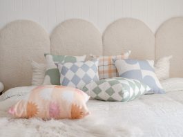 Arched Boucle bedhead with The Tartan Space cushions