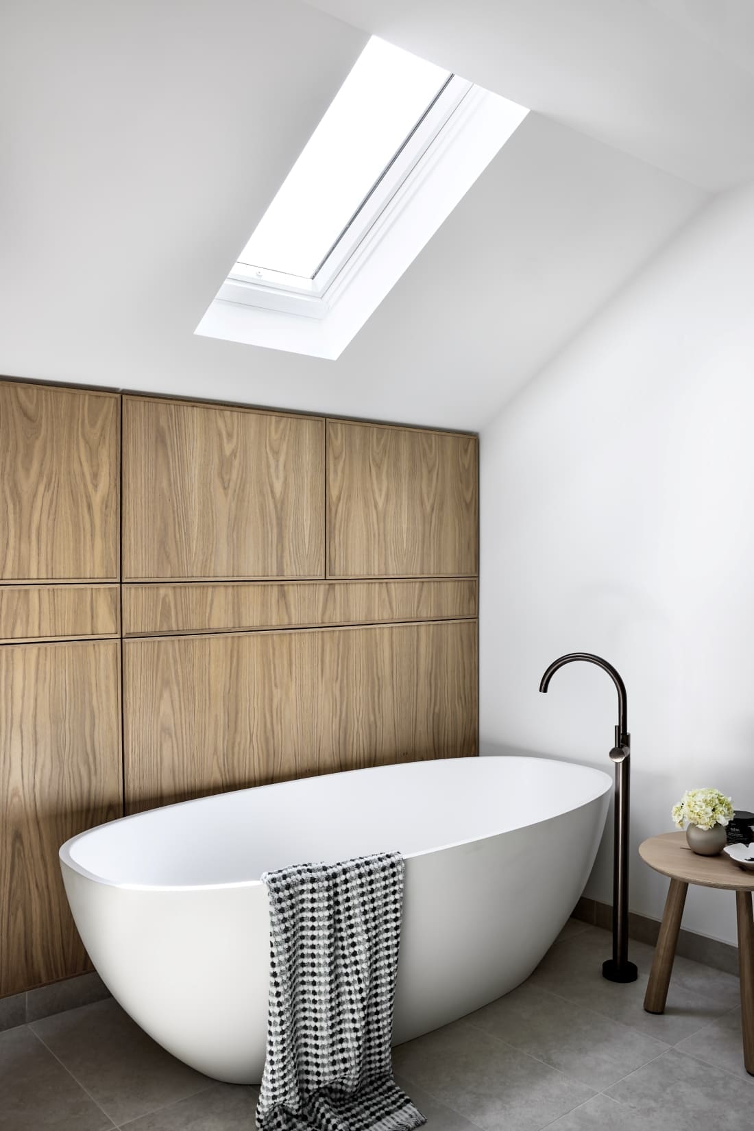 White bathtub in neutral bathroom