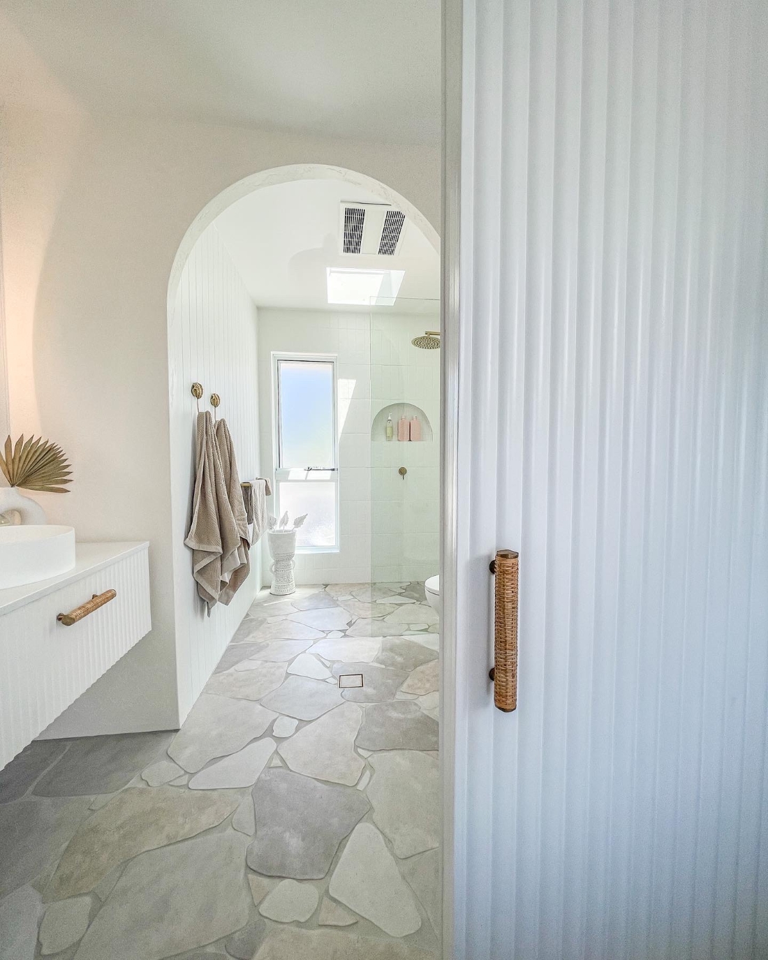 White ensuite with scalloped door _ coastal ensuite makeover