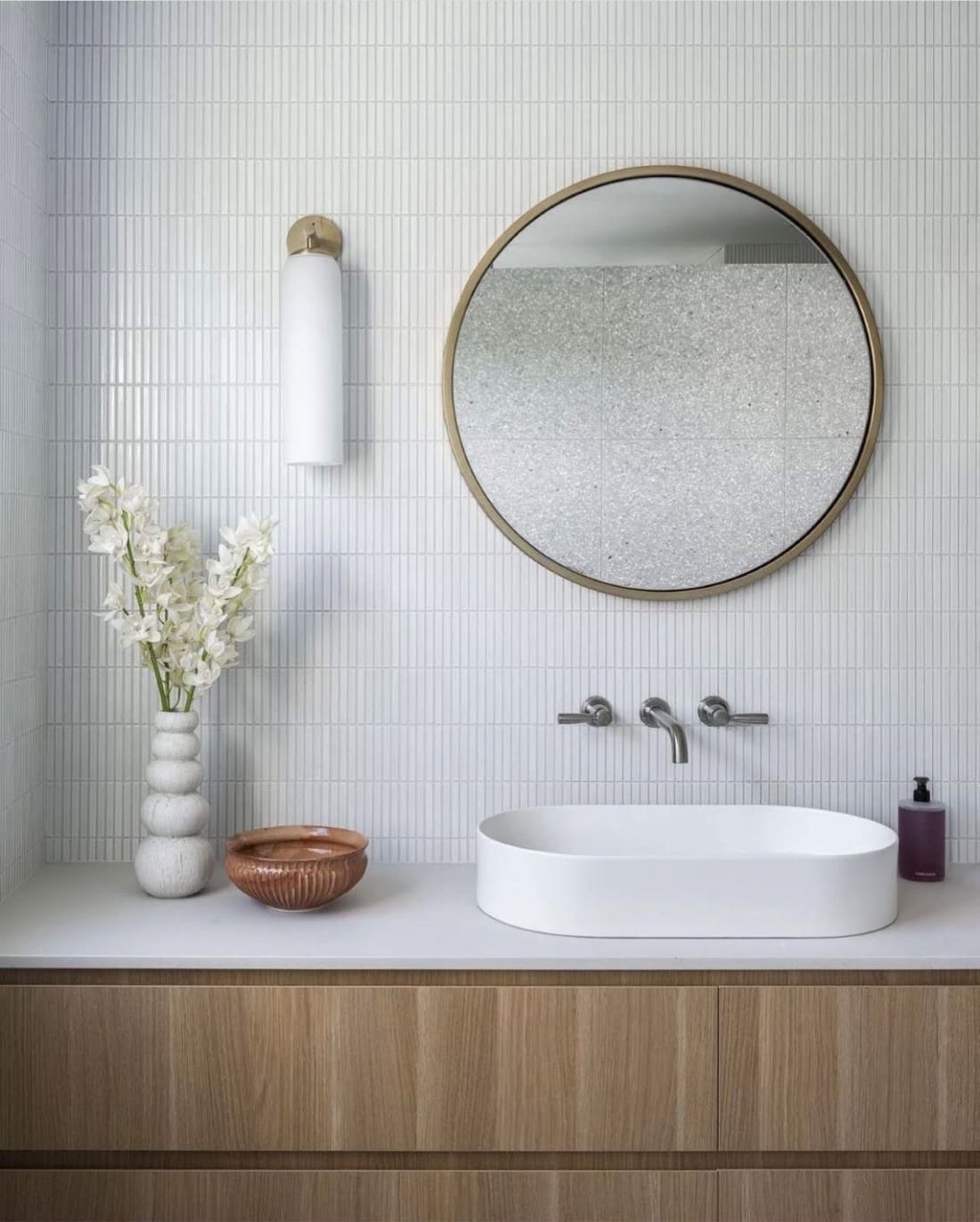 stainless steel taps in white bathroom