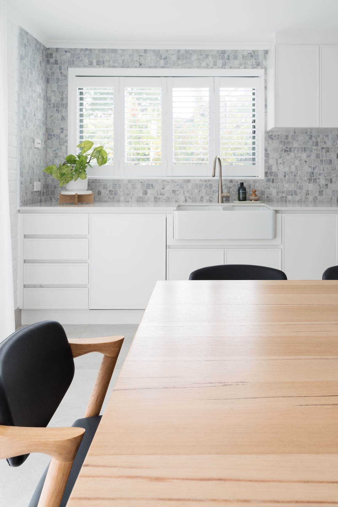 Plantation shutter above sink in kitchen