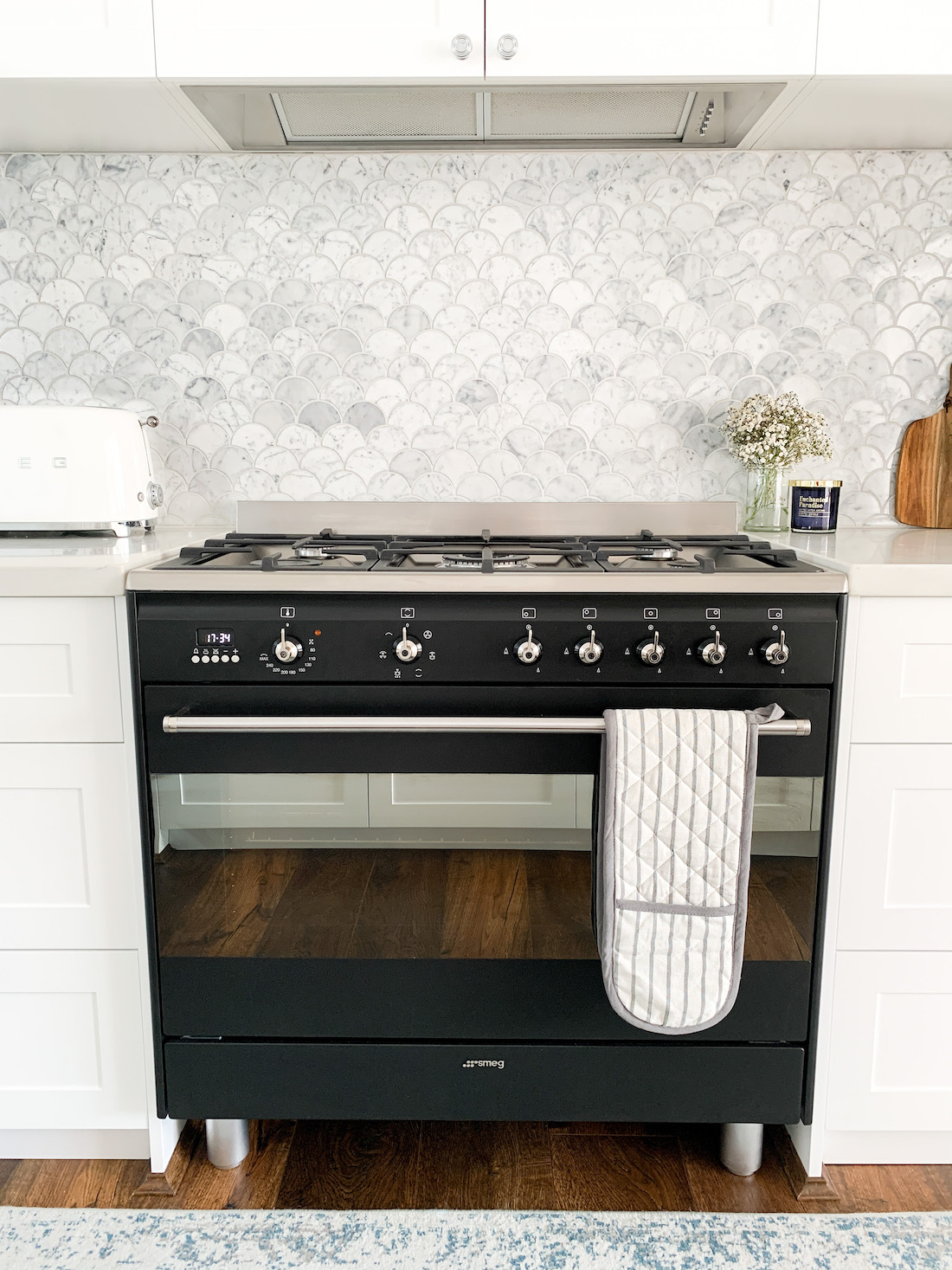White kitchen with black stove