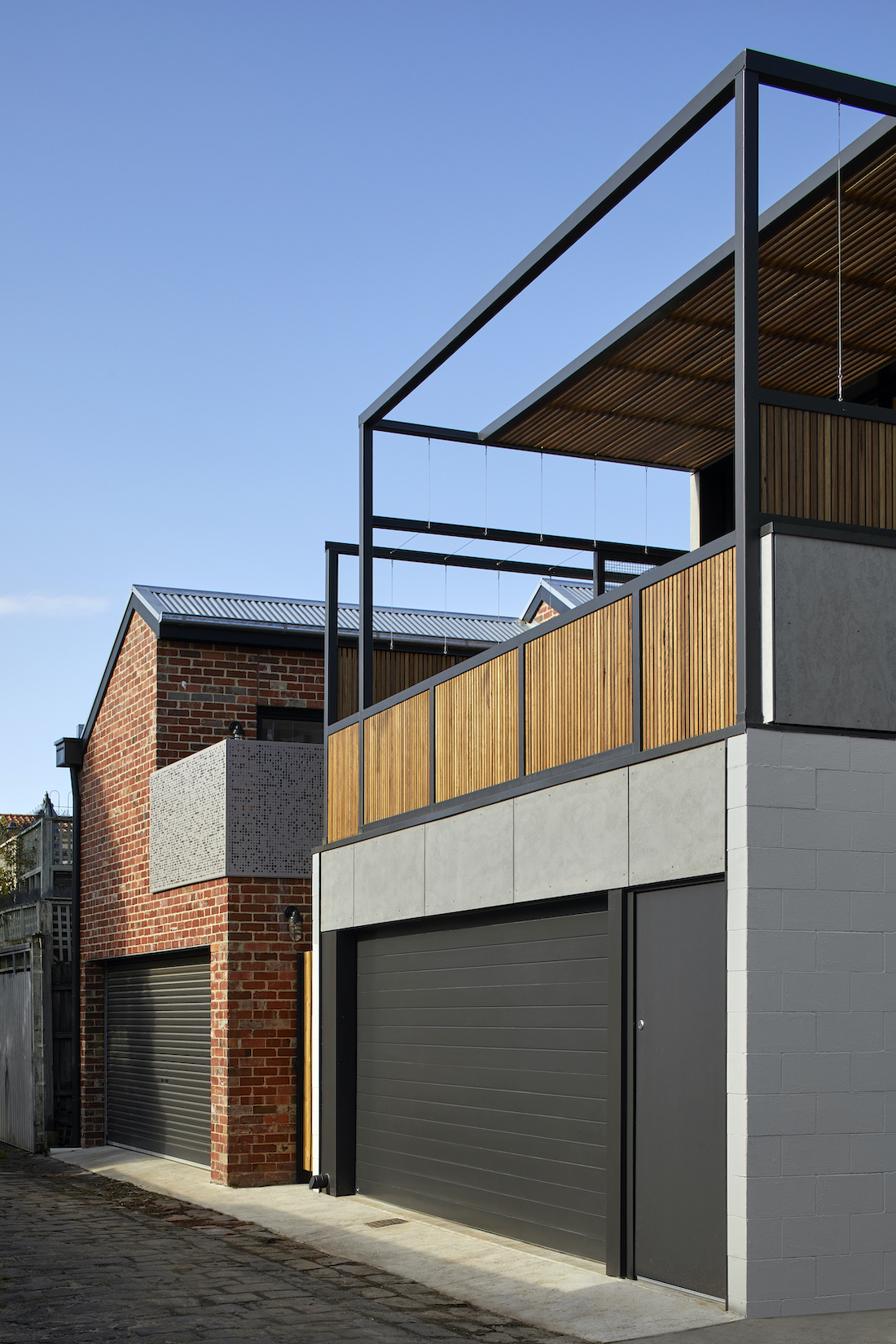 black garage doors_ sustainable heritage-listed home renovation