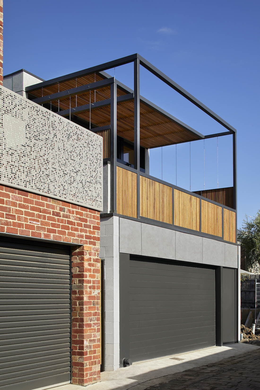 modern black garage doors _ sustainable heritage-listed home renovation