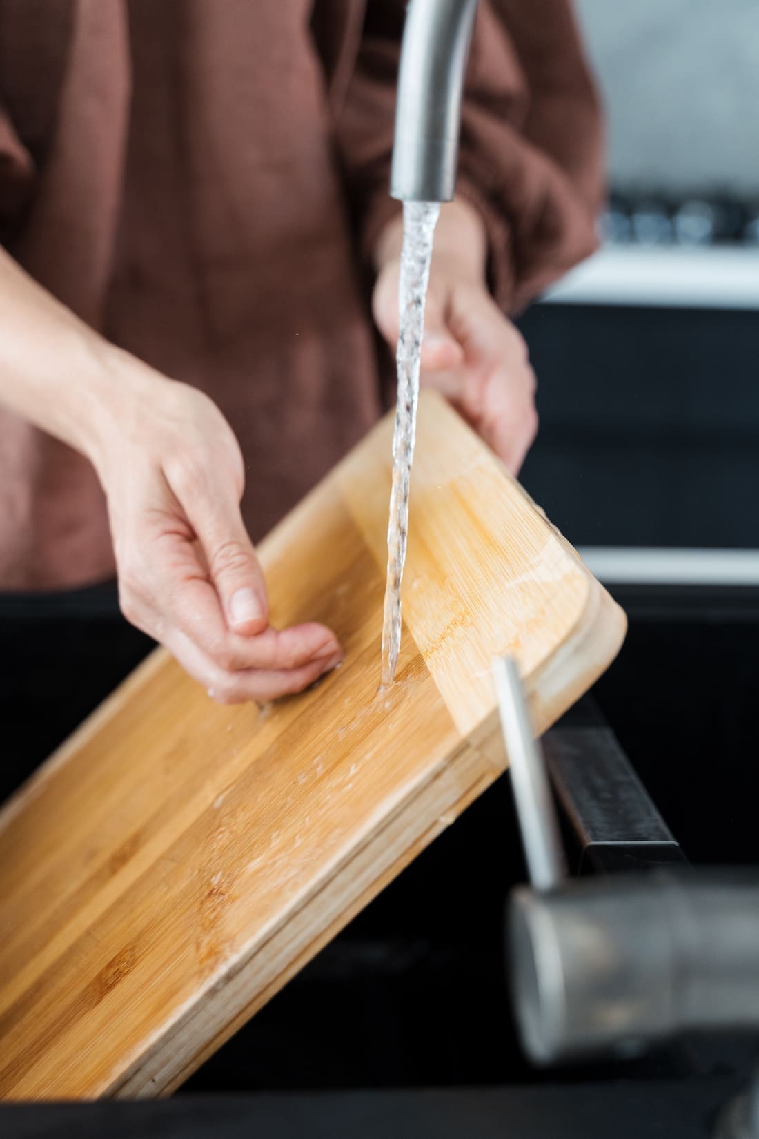 Rinse paste off chopping board